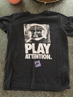 Nike Black Graphic 'PLAY ATTENTION' Tee with Purple Logo